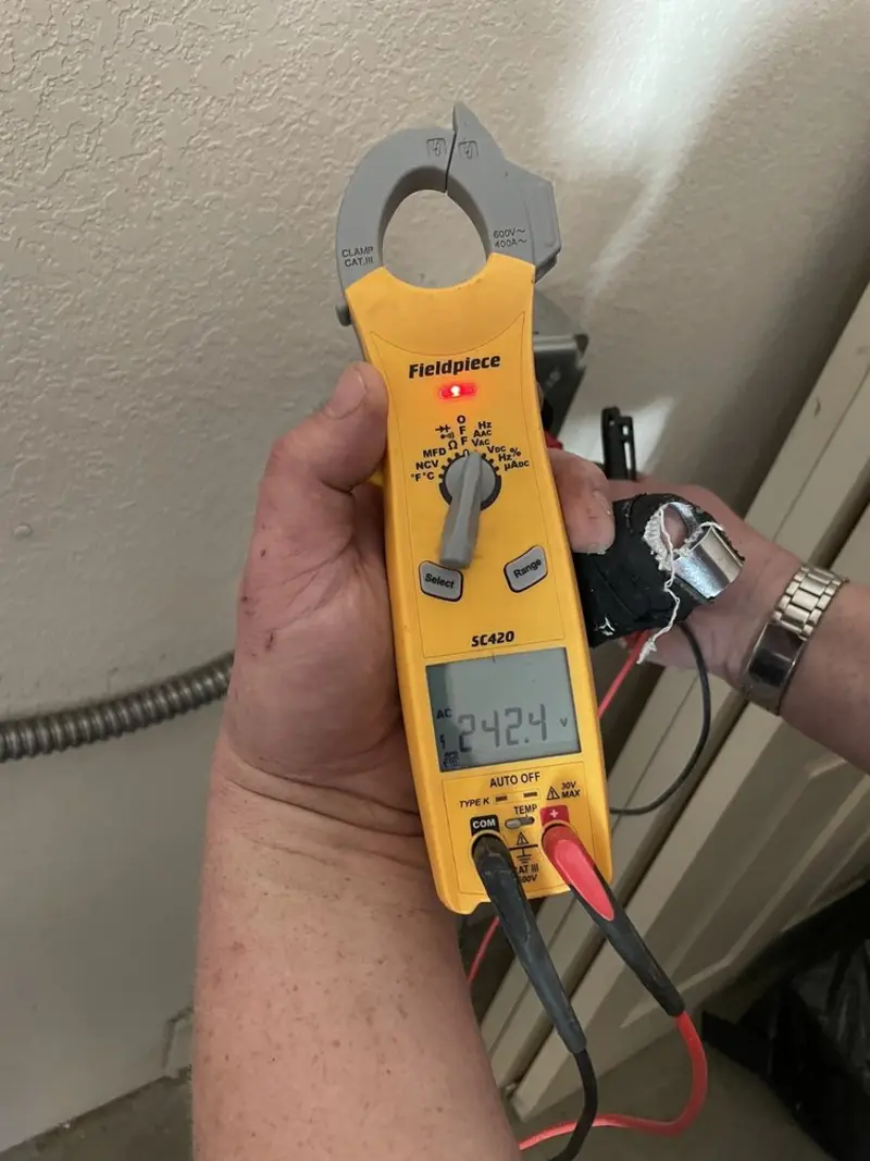 Voltage testing with clamp meter during Outlet Installation in Webster Groves